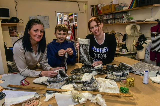 Angela Harrop (left) who owns Twisted Lace Fabrics and Costumes, Tower Steet, Hartlepool, enlisted son Kian (13) and Wendy Stones to make Christmas stocking and decorations for a worthy cause in 2016.