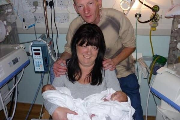 Lisa, Ian and the twins in hospital at the beginning.