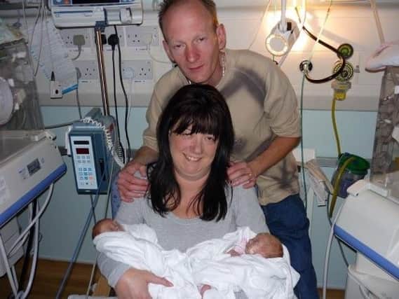 Lisa, Ian and the twins in hospital at the beginning.