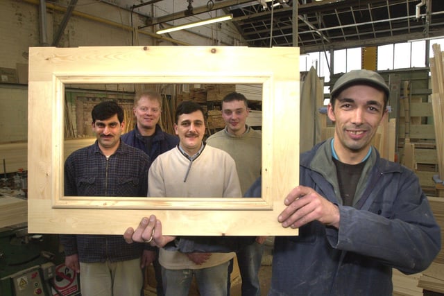 At the start of the kitchen building process LtoR are,  Ashfaq Hamad, Tim Roberts, Zak Rahman, Chris Green, and Adrian Ball holding the frame.