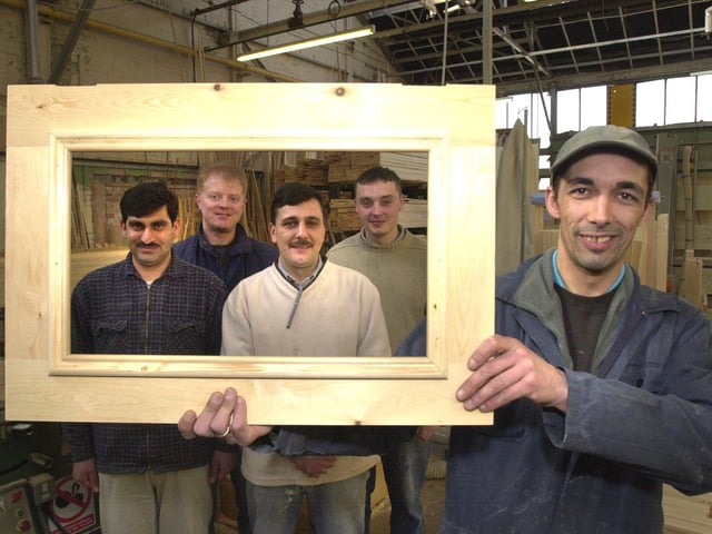 At the start of the kitchen building process LtoR are, Ashfaq Hamad, Tim Roberts, Zak Rahman, Chris Green, and Adrian Ball holding the frame.