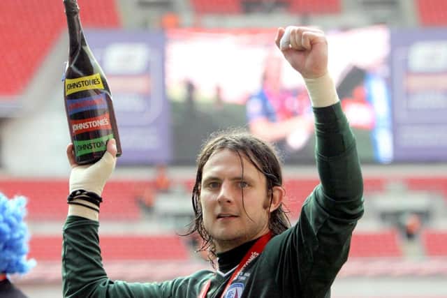 Lee celebrates Chesterfield winning the JPT Trophy in 2012.