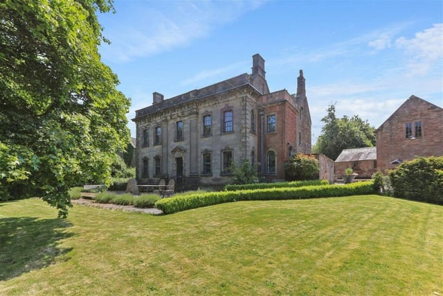 The property is set in 2.5 acres of gardens and has an additional five acres of paddocks.