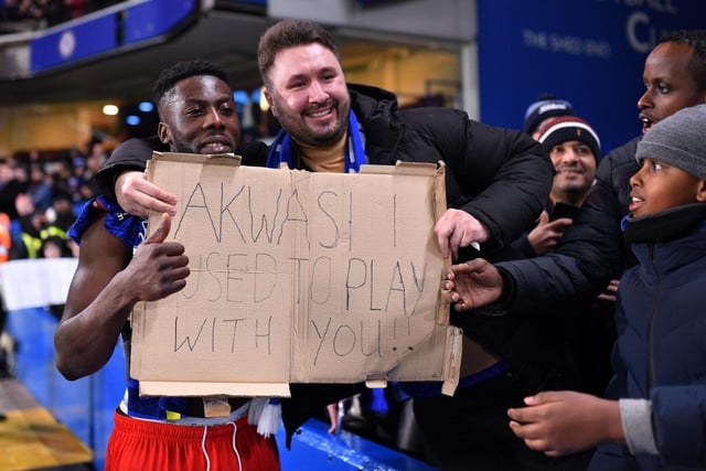 Akwasi Asante poses with a fan following the Emirates FA Cup Third Round match between Chelsea and Chesterfield at Stamford Bridge on January 08, 2022.