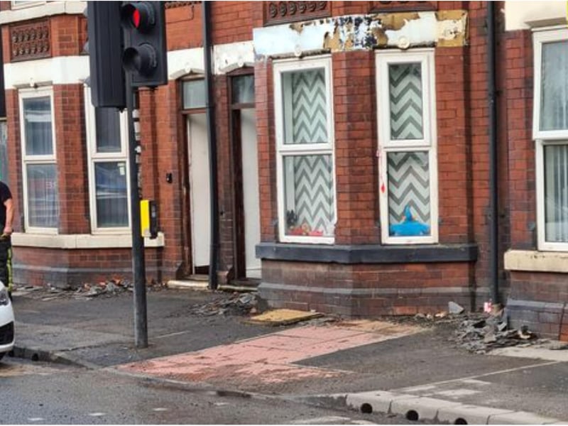 Debris left following the fire litters the street.