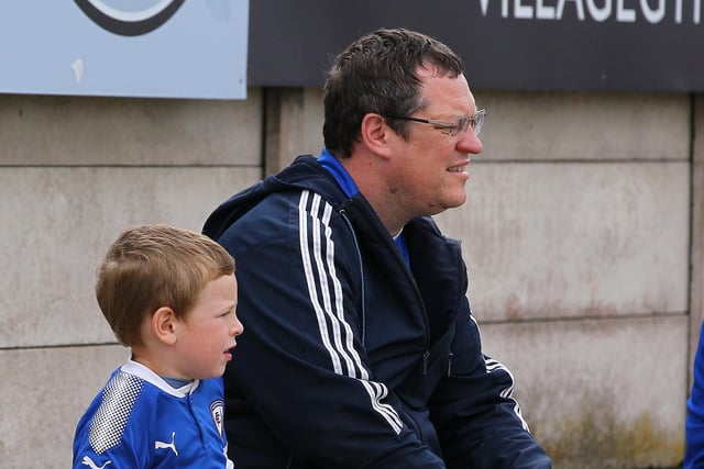 A young Chesterfield fan waits to welcome his team on to the pitch.