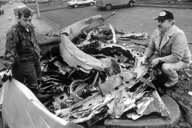 Pratt and Whitney engine experts with the most damaged jumbo jet engine in the Lockerbie Air crash.