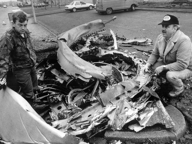Pratt and Whitney engine experts with the most damaged jumbo jet engine in the Lockerbie Air crash.