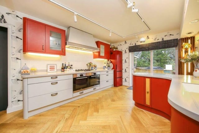 Three buil-in ovens, a central island and Corian worktops...who wouldn't love preparing meals in this fabulous kitchen?