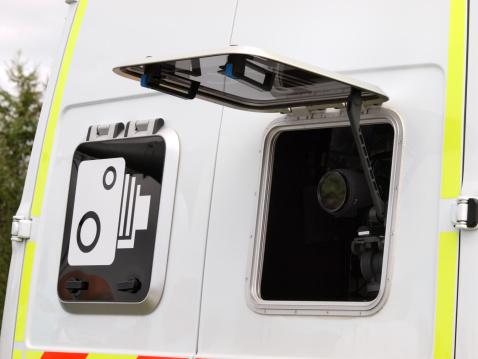 A Police speed camera in the back of a van.