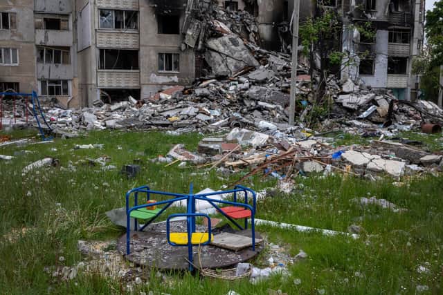 Uninhabitable apartment buildings stand in ruins in a former frontline neighborhood in Kharkiv, Ukraine. Invading Russian forces targeted residential apartment buildings during their attacks on Kharkiv. (Photo by John Moore/Getty Images)