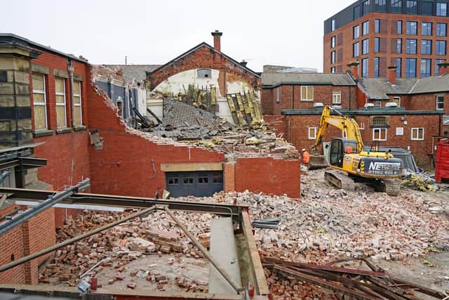 This photo shows part of the complex being demolished.