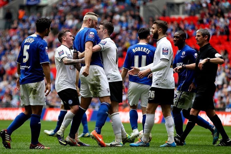Tempers flare between the two sides during the Johnstone's Paint Trophy Final between Chesterfield and Peterborough United at Wembley Stadium on March 30, 2014.