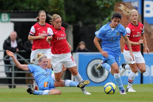 Jordan Nobbs of Arsenal is tackled by Millie Bright during a game in 2012.