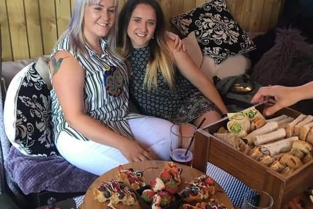 Beth, right, with her sister on a happy day. Now her family are lodging a medical negligence claim after her cancer was not correctly diagnosed at the time. Photo submitted