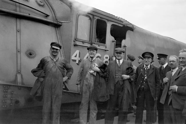 From the left fireman T Bray, driver J Duddington, inspector J Jenkins and a guard after the record breaking run. when the locomotive achieved 126 mph which has remained unmatched by any steam locomotive