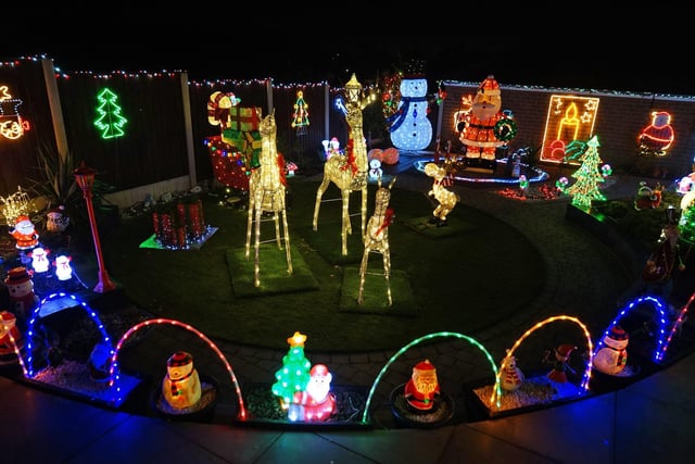 The couple devoted 200 hours to creating their Christmas lights display.