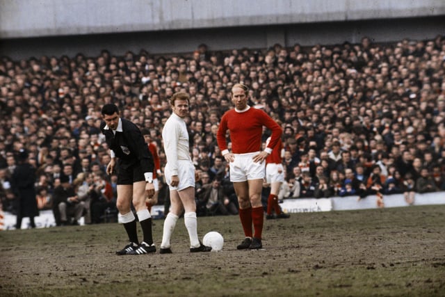 1970: Billy Bremner and Bobby Charlton of Manchester United with referee Jack Taylor during a match.