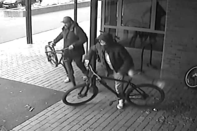 Police investigating the theft of two bikes outside a Derbyshire leisure centre have released this CCTV image of two men they would like to speak to.