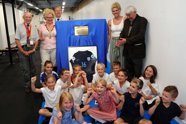 England Ladies and Chelsea Ladies player, Millie Bright, second right, opens the new Functional Training Suite with Coun. Barry Jones, Chairman of the Parish Council, left, local school children and invited guests.