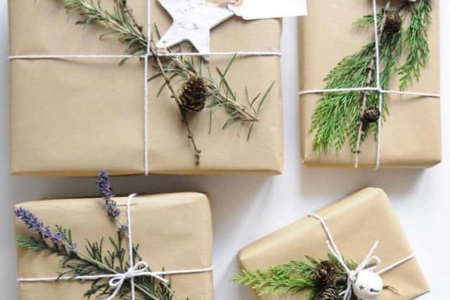 Consider recycled brown paper, this looks traditional and can be reused and recycled.