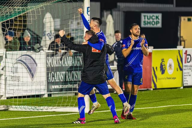 Matlock's players celebrate in front of their fans at the final whistle. Photo: Martin Taylor/@shotbybamboo.