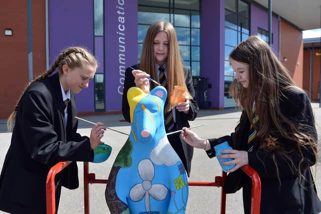 Heritage High School, Clowne. Painting one of the Bears of Sheffield are students Ella Johnson, Olivia Stafford and Daisy Atkinson who also did the design.