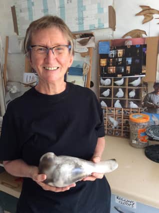 Chesterfield  ceramacist Vivienne Sillar with a pigeon she created during lockdown