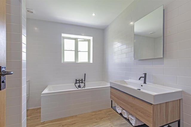The modern bathroom on the first floor contains a bath, separate shower cubicle, wash basin and wc.
