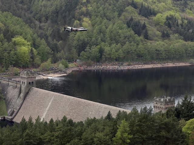 A Lancaster bomber flies over Ladybower reservoir to mark the 70th anniversary of the World War II Dambusters mission on May 16, 2013. (Photo by Christopher Furlong/Getty Images)