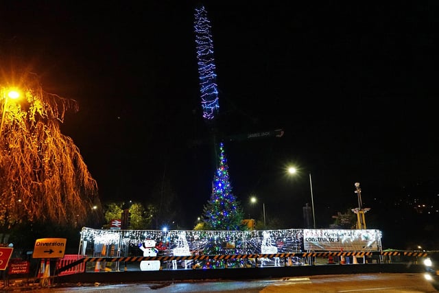 The giant crane being used to repair the town's flood defences was festooned with lights