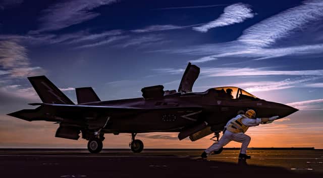 An F-35B Lightning jet sits on HMS Queen Elizabeth's flight deck during her Westlant 19 deployment to the east coast of the USA. This image was part of the winning selection by Photographer of the Year Leading Photographer Kyle Heller. It also won the Maritime Air Prize.