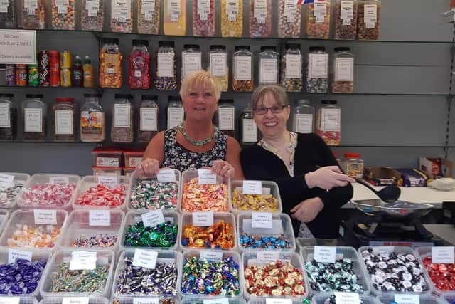 Lizzy Johnson, left, and Suzi Stevenson behind the counter at Aunty Dot's Sweets.