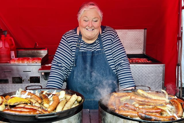 A vendor selling sizzling sausages was among the nearly 100 traders who supported the festival.