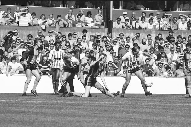 A match against Southampton on 25 August 1984. The match ended in a 3-1 victory to Sunderland. Black Cats players Howard Gayle (far left) and Clive Walker (far right).