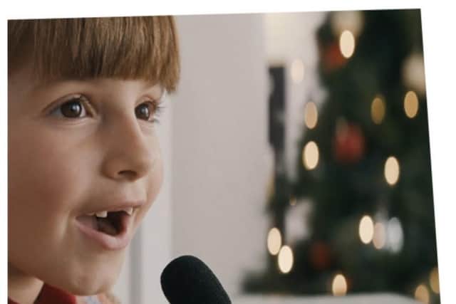 In the advert, Olympia walks up to a microphone in the shop and asks what would Snta have for Christmas dinner.
