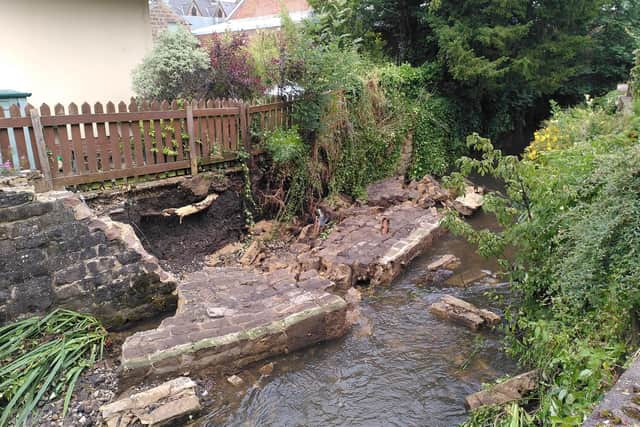 The collapsed wall on Bentley Brook is just metres from the Tawney House flats off Matlock Green. (Photo: Moyra Wilson)