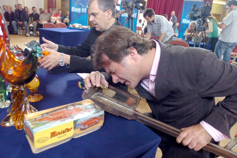 FLOG IT VALUATION DAY   Presenter Paul Martin takes a close look at a stick thermometer brought in for valuation at the Winding Wheel, Chesterfield.     10 September 2006
