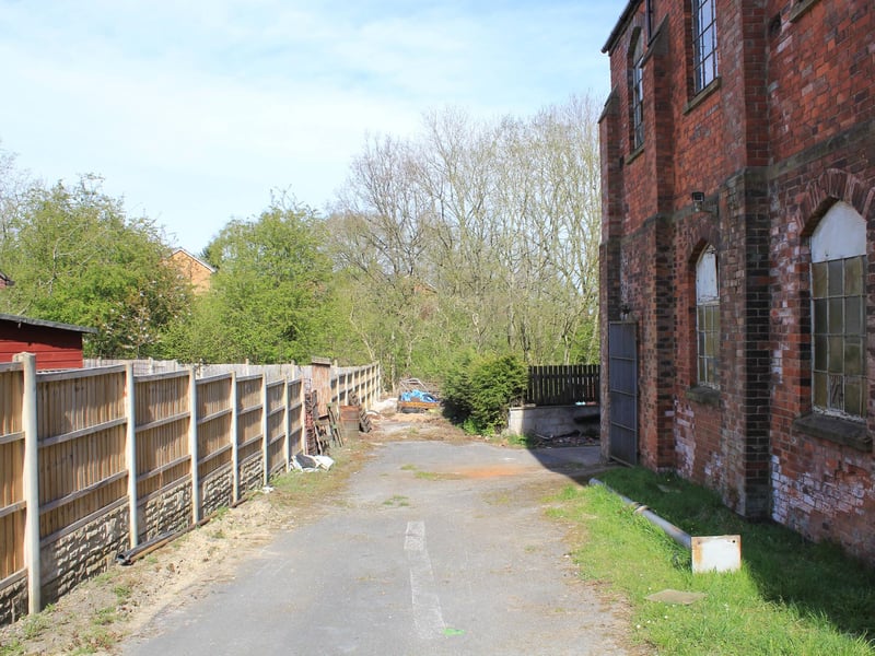The long driveway at the building.