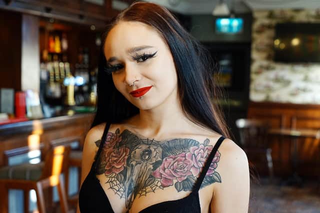 Molly Jarvis - the Three Merry Lads in Cutthorpe is bidding to win a magazine competition with her multiple tattoos.