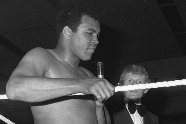 Ali takes time to speak to the audience at the Washington exhibition bout.