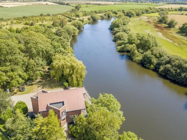 There is a substantial sized lawned garden with surrounding woodlands.