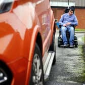 Chesterfield man Aaron Hollingsworth says he regularly struggles to move his powerchair due to cars parked on the pavement. Pictures by Brian Eyre.