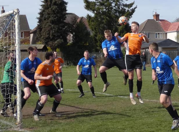 Action from Boot & Shoe (blue) against Mutton. Photo by Martin Roberts.