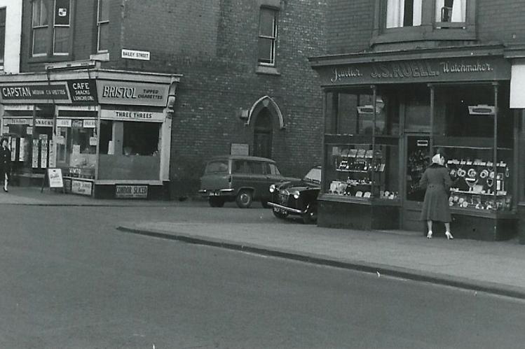 This undated photograph shows Ruell's jeweller and an un-named cafe. Who can tell us more?