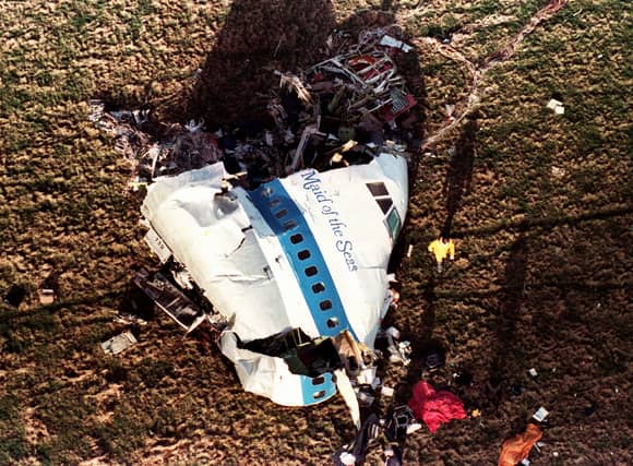 The nose section of Pan Am Flight 103, a 747 airliner lies in a field outside the village of Lockerbie, Scotland, in this Dec. 22, 1988 file photo.