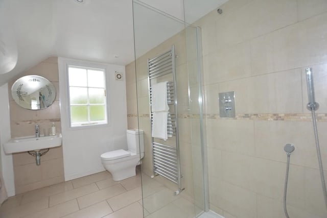 As well as the three bedrooms, the first floor also houses this shower room. A walk-in Bristan shower is complemented by a low-level WC, wash hand basin and heated towel-rail
