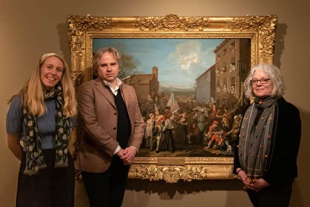 Senor curator Lucy Bamford, executive director Tony Butler and exhibition co-curator Dr Jacqueline Ridingwith Hogarth's The March of the Guards to Fincheley, 1749-50 from The Foundry Museum, London (photo: Oliver Taylor/Derby Museums)