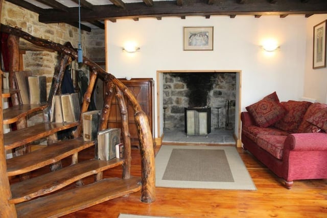 The lounge has an inglenook fireplace with exposed stonework.