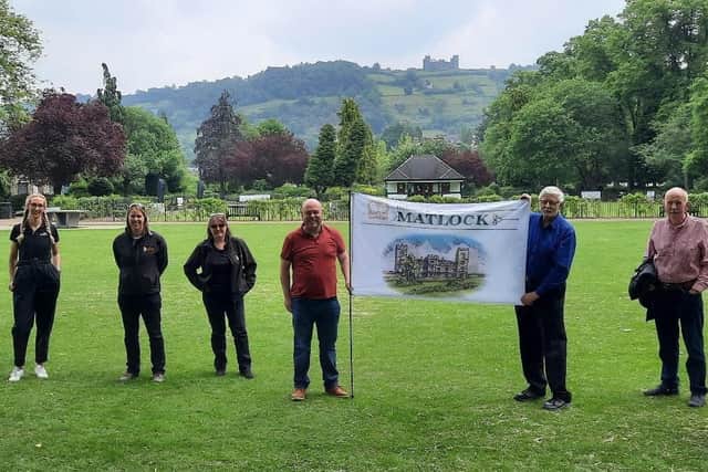 Matlock business owners and councillors proudly display the new flag.